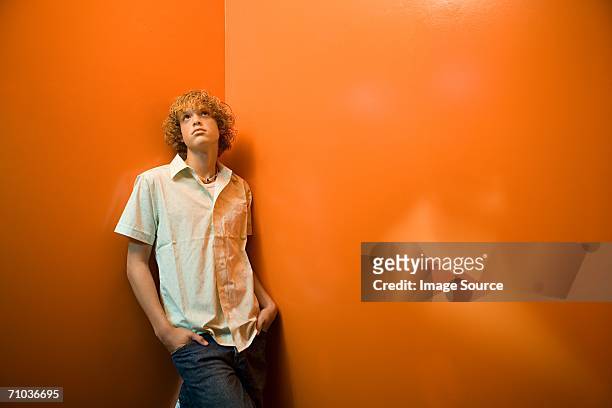 teenage boy standing alone - three quarter length stock pictures, royalty-free photos & images