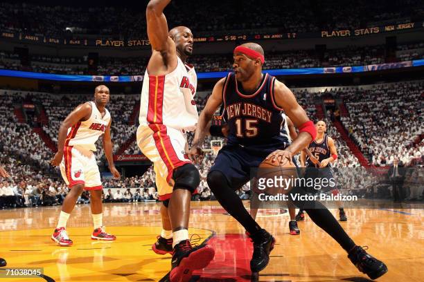 Alonzo Mourning of the Miami Heat defends against Vince Carter of the New Jersey Nets in game five of the Eastern Conference Semifinals during the...