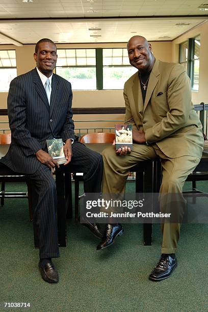 Legends Albert King and Darryl Dawkins pose at Barnes and Noble during an event to encourage visitors to read and "Aim High - Live Classic" on May...