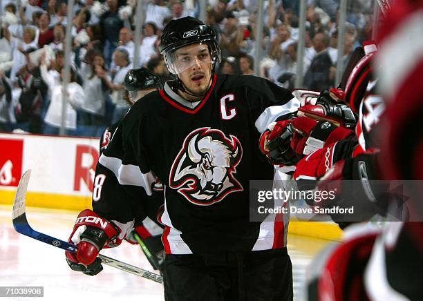 Daniel Briere of the Buffalo Sabres is congratulated by teammates after scoring a goal in the second period of game three of the Eastern Conference...