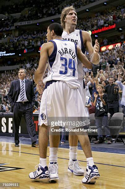 Devin Harris of the Dallas Mavericks hugs teammate Dirk Nowitzki near the end of game one of the Western Conference Finals against the Phoenix Suns...