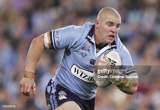 Mark O'Meley of the Blues runs the ball during game one of the ARL State Of Origin series between the New South Wales Blues and the Queensland...