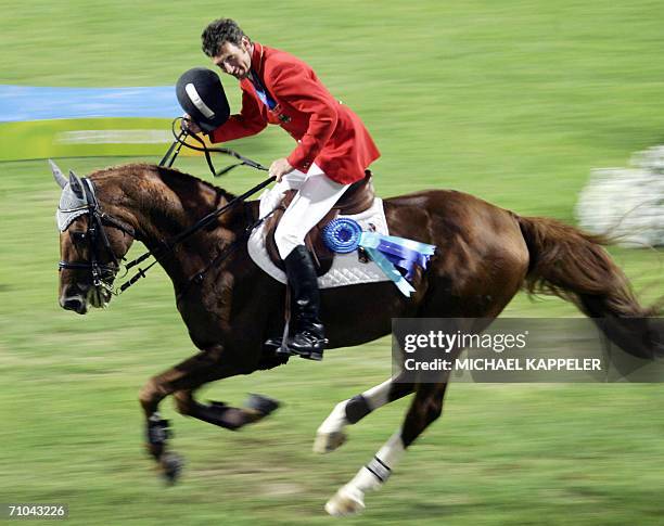 German jumping rider Ludger Beerbaum rides on his horse "Goldfever" 24 August 2004 at the Markopoulo Olympic Equestrian Centre in Ahtens after the...