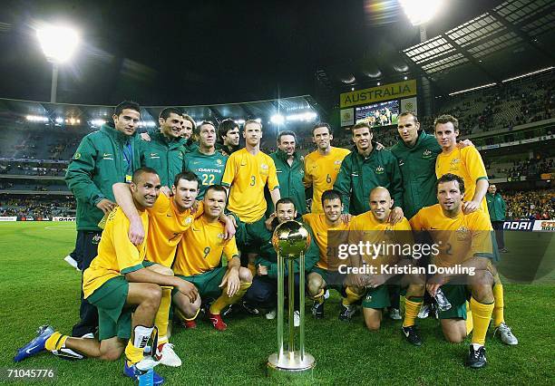 The Australian Socceroos pose with the trophy after winning the Powerade Cup international friendly match between Australia and Greece at the...