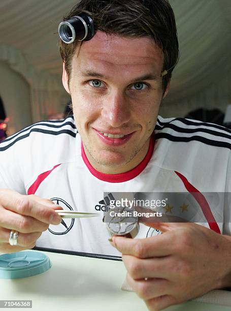 Sebastian Kehl shows his work during a visit by the German national football team to a watchmaker on May 24, 2006 in Geneva, Switzerland