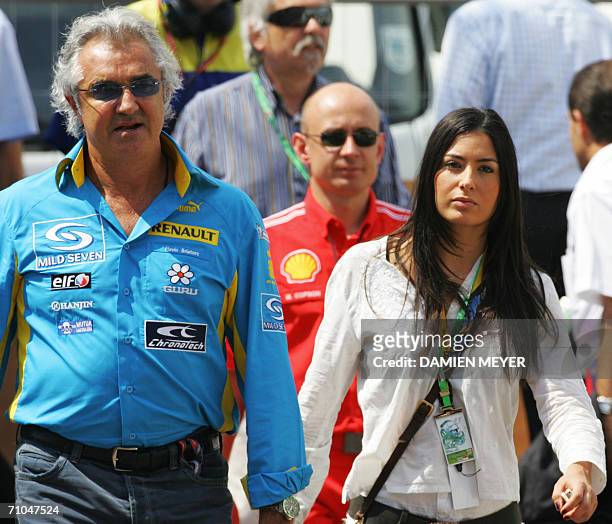 Renault managing director Flavio Briatore and his girlfriend Elisabetta Gregoraci walk on the paddock of the Monaco racetrack, 25 May 2006 in Monaco,...