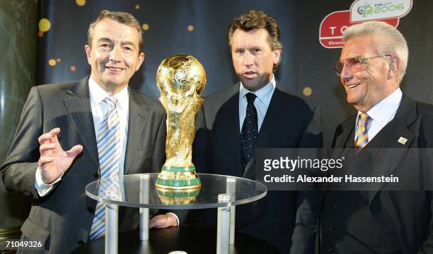 Wolfgang Niersbach , Vice President of the World Cup 2006 Organising Committee poses with former Soccer player Manfred Kaltz , Friedel Guett ,...