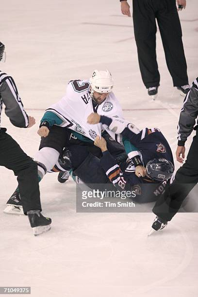 Left wing Ethan Moreau of the Mighty Ducks of Anaheim fights with defenseman Joe DiPenta of the Edmonton Oilers in game three of the NHL Western...