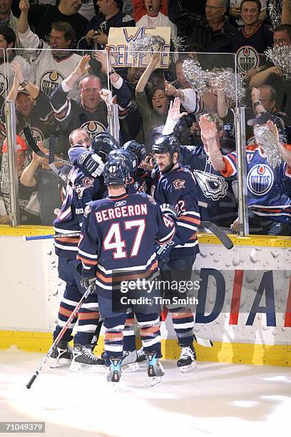 Defenseman Marc-Andre Bergeron of the Edmonton Oilers celebrates with his teammates in game three of the NHL Western Conference Finals against the...