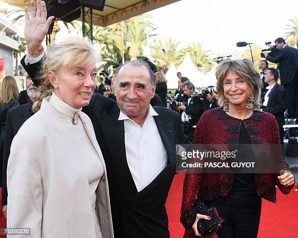 French actor Claude Brasseur and his wife Michele Cambon-Brasseur arrive with producer Danielle Thomson at the Festival Palace to attend the premiere...