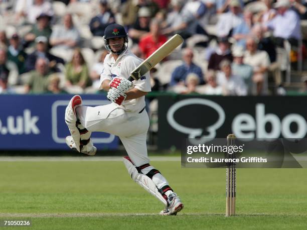 Mal Loye of Lancashire smashes the ball for four during the Liverpool Victoria County Championship match between Lancashire and Nottinghamshire at...