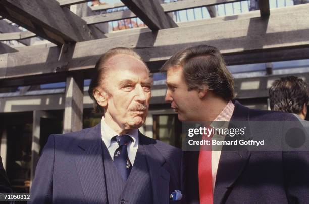 American businessman Donald Trump talks to his father, real estate developer Fred C. Trump , 1980s.