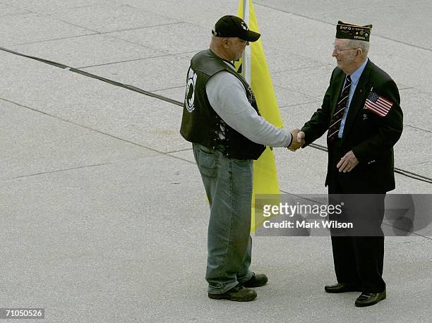 Army Colonel Bill Huber of Alexandria, Virginia greets a fellow vet during pre Memorial Day rally on the West Front of the U.S. Capitol building May...