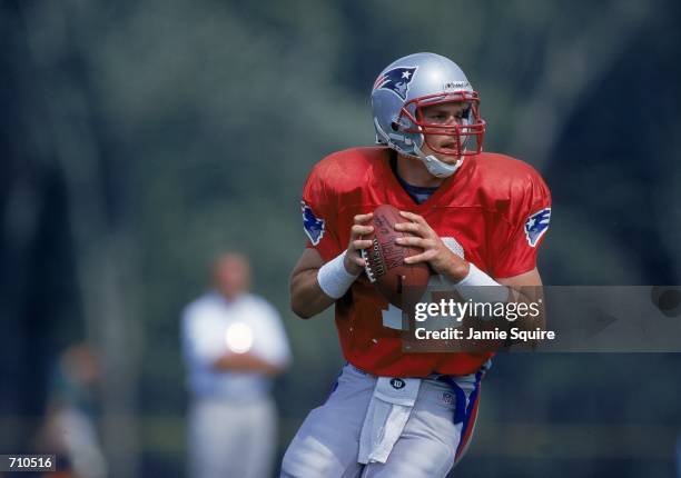 Quarterback Tom Brady of the New England Patriots looks to pass the ball during the Patriots Training Camp at Bryant College in Smithfield, Rhode...