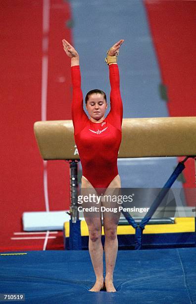 Elise Ray finishes her routine in the Vault Event during the U.S. Women's Olympic Gymnastics Trials at the Fleet Center in Boston,...