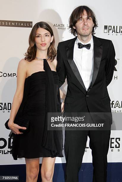 Director Sofia Coppola and her companion Phoenix singer Thomas Mars arrive to attend the amfAR?s annual "Cinema Against AIDS 2006" event at Le Moulin...