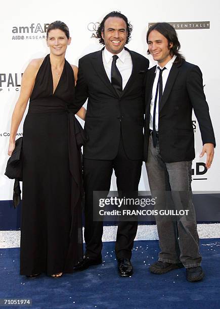 Mexican actor Gael Garcia Bernal , director Alejandro Gonzalez Inarritu and a guest pose as they arrive to attend the amfAR?s annual "Cinema Against...