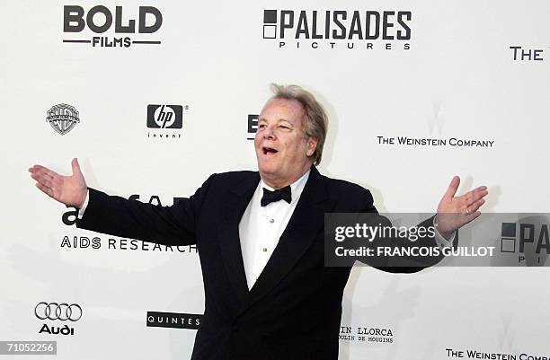 Italian jet setter Massimo Gargia gestures as he arrives to attend the amfAR?s annual "Cinema Against AIDS 2006" event at Le Moulin de Mougins during...