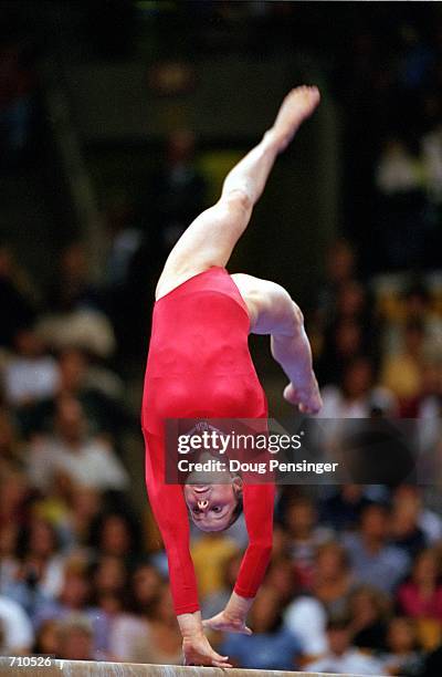 Elise Ray is doing her routine in the Balance Beam Event during the U.S. Women's Olympic Gymnastics Trials at the Fleet Center in Boston,...