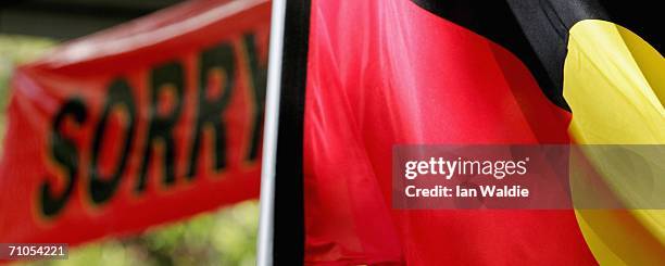 An Aboriginal flag files near a "Sorry" banner during an event to mark Sorry Day May 26, 2006 in Sydney, Australia. The first National Sorry Day was...