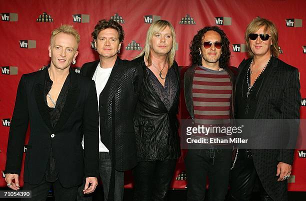 Members of the rock band Def Leppard guitarist Phil Collen, drummer Rick Allen, bassist Rick Savage, guitarist Vivian Campbell and singer Joe...