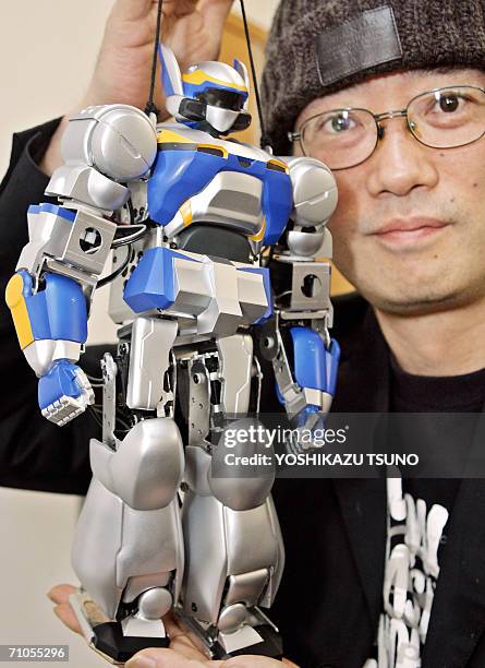 Robot designer Yutaka Izubushi displays the new humanoid robot "HRP-2m Choromet", which is downsized model of a well known humanoid robot "HRP-2...