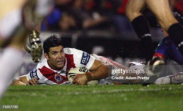 Trent Barrett of the Dragons scores during the round 12 NRL match between the Newcastle Knights and the St George Illawarra Dragons at Energy...