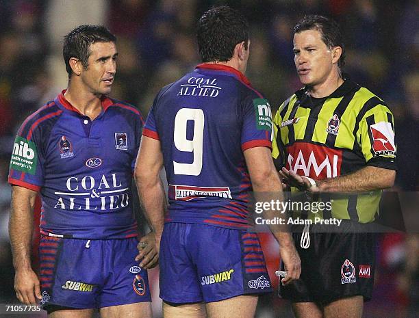 Andrew Johns and Danny Buderus of the Knights have words to referee Tony Archer after a Dragons try during the round 12 NRL match between the...