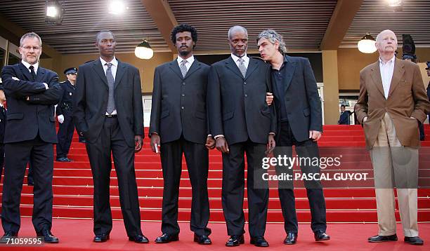 Portuguese director Pedro Costa talks to actor Ventura as they pose with the Artistic director of the Festival Thierry Fremaux, Antonio Semedo,...