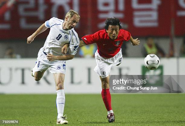 Kim Young-Chul of South Korea battles for the ball with Sergej Barbarez of Bosnia-Herzegovina during the International friendly match at the SangAm...