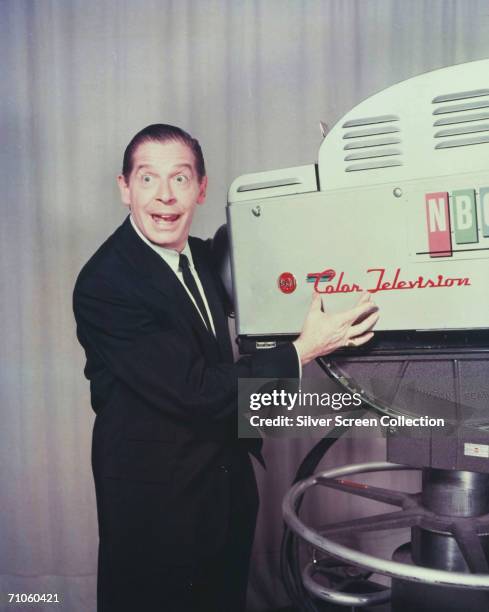 American comedian Milton Berle at an N.B.C. TV studio with a television camera, circa 1955.