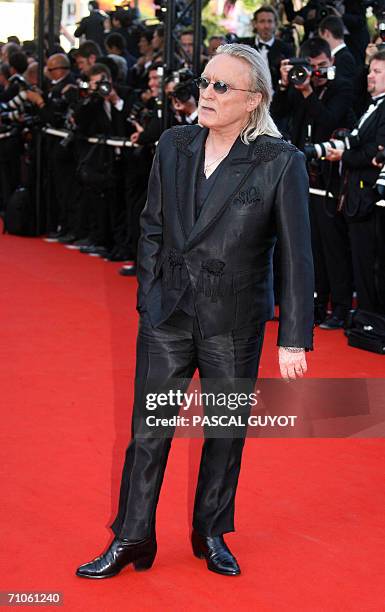 French singer Christophe arrives at the Festival Palace to attend the premiere of French director Xavier Giannoli's film 'Quand j'etais chanteur' at...