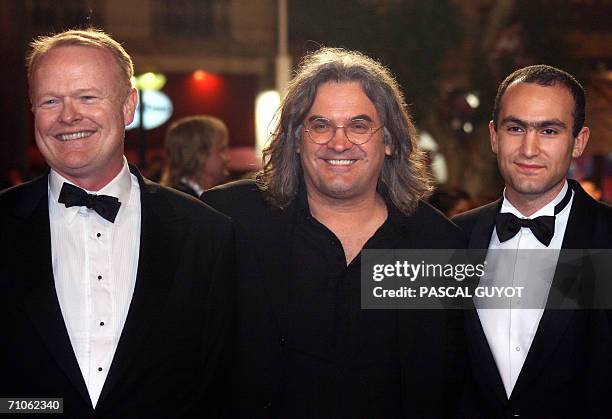 British director Paul Greengrass arrives with US actors Christian Clemenson and British actor Khalid Abdalla pose upon arriving at the Festival...