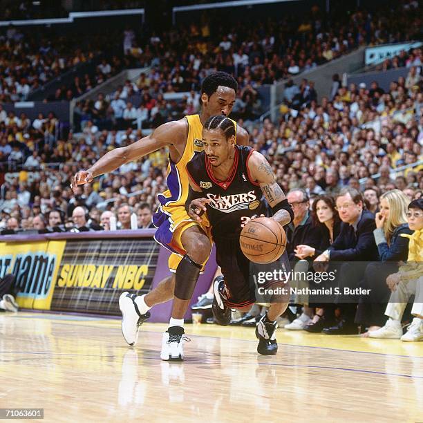 Allen Iverson of the Philadelphia 76ers drives to the basket against Kobe Bryant of the Los Angeles Lakers during game two of the 2001 NBA Finals...