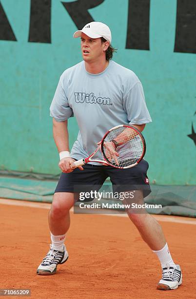 Coach Leon Smith practices with Andy Murray of Great Britain during practice prior to the French Open at Roland Garros on May 27, 2006 in Paris,...