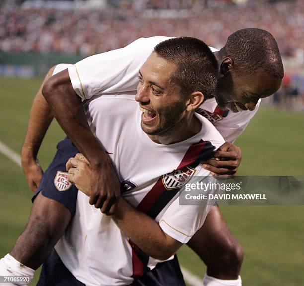 Cleveland, UNITED STATES: Clint Dempsey of the United States National Men's Soccer Team celebrates with teammate DaMarcus Beasley after scoring a...