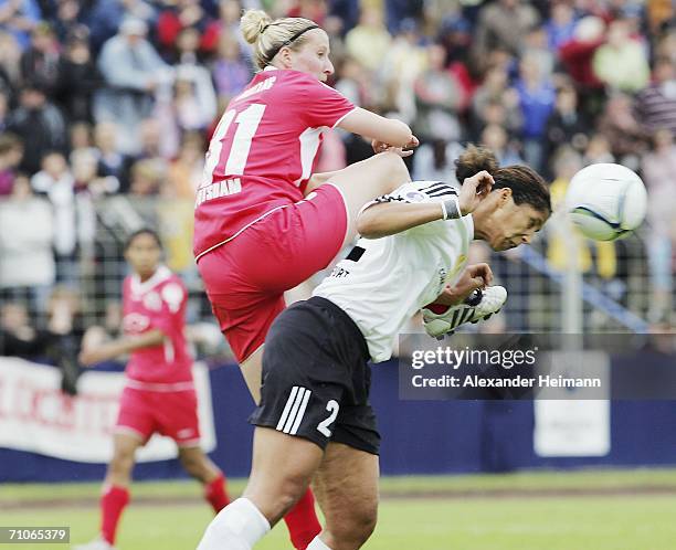 Steffie Jones of Frankfurt clashes with Anja Mittag of Potsdam whilst going for a header during the Women's UEFA Cup Final second leg match between...