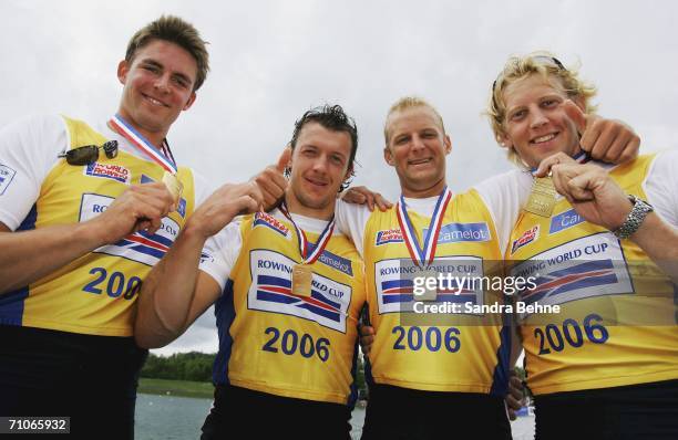 Peter Reed, Steve Williams, Alex Partridge and Andrew Triggs Hodge of Great Britain pose for a photo winning the gold medal of their men's four final...