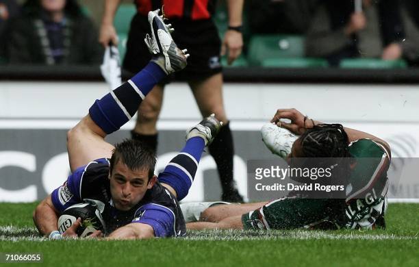 Oriol Ripol of Sale dives past Leicester's Alesana Tuilagi to score his team's third try during the Guinness Premiership Final between Sale Sharks...