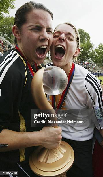 Ursula Holl and Nia Kuenzer of Frankfurt celebrate after winning the Women's UEFA Cup Final second leg match between FFC Frankfurt and FFC Turbine...