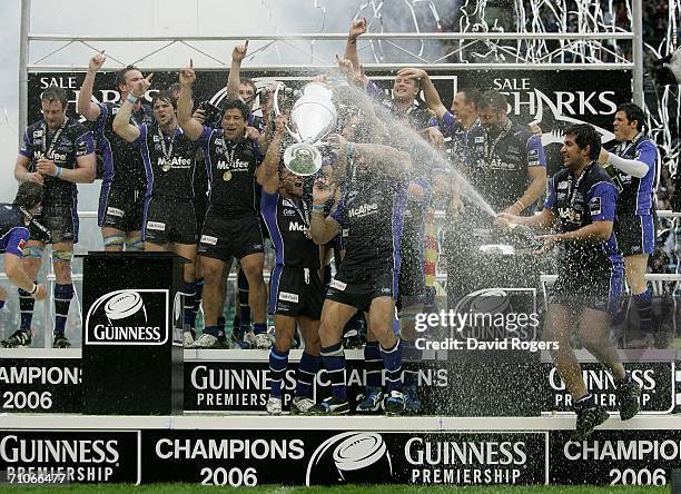 Jason Robinson the Sale Captain lifts the trophy following his team's victory during the Guinness Premiership Final between Sale Sharks and Leicester...