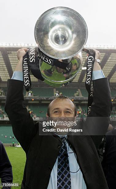 Philippe Saint Andre the Sale Director of Rugby lifts the trophy after his team's victory during the Guinness Premiership Final between Sale Sharks...
