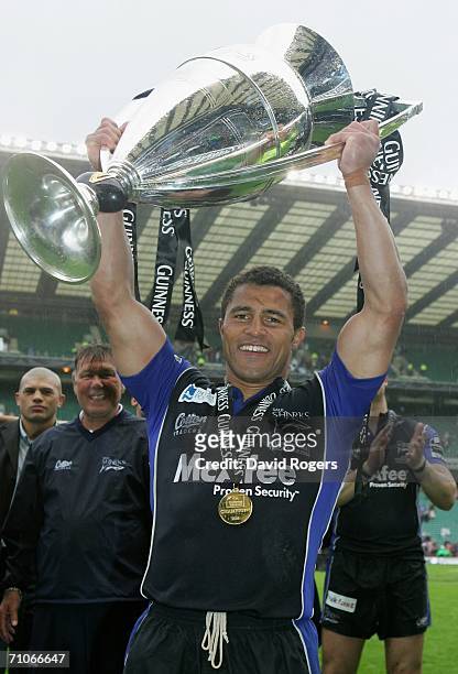 Jason Robinson the Sale Captain celebrates with the trophy following his team's victory during the Guinness Premiership Final between Sale Sharks and...