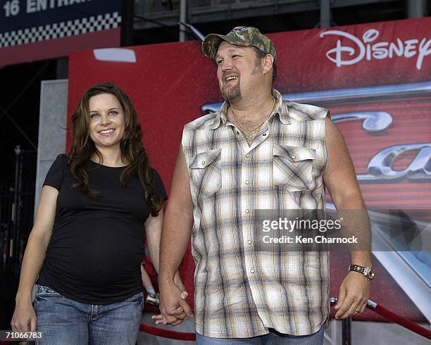 Larry the Cable Guy , voice of Mater, and his wife Cara Whitney attend the world premiere screening of the Disney and PIXAR movie "Cars" at Lowe's...