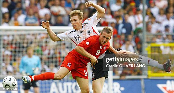 Germany's defender Per Mertesacker vies against Luxemburg's Joachim Aurelien, 27 May 2006 at the Badenova-Stadion in Freiburg, southern Germany,...