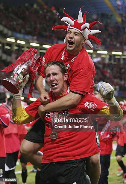 Nick Colgan, goalkeeper of Barnsley, celebrates with a team-mate after gaining promotion to the championship after the League One Playoff Final match...
