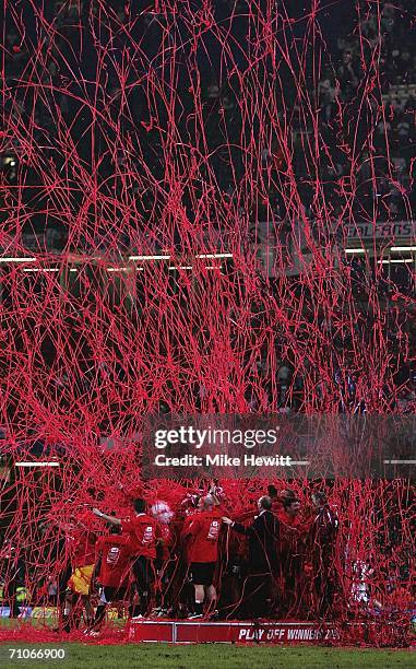 Barnsley receive the Playoff Trophy in a shower of bunting following the Coca-Cola Football League One Playoff Final between Barnsley and Swansea...