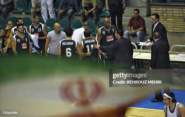 An Iranian flag flutters as Lebanon's Sagesse team players leave during the fourth leg of their basketball match against Iran's Saba Battery in the...