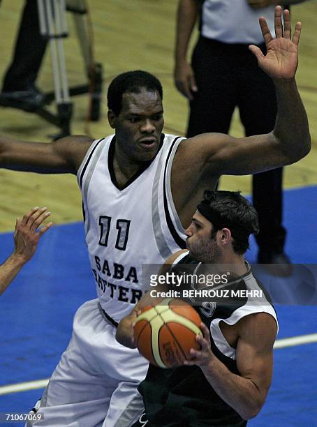 Iran's Saba Battery player, Grith Joseph, vies with Lebanese Sagesse player Bassam Balaa during the finals of the West Asian Clubs Championship at...