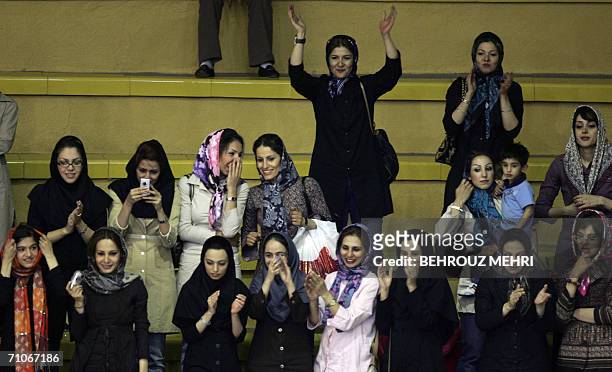 Iranian female fans cheer the Islamic republic's Saba Battery team during their final West Asian Clubs Championship basketball game against Lebanon's...